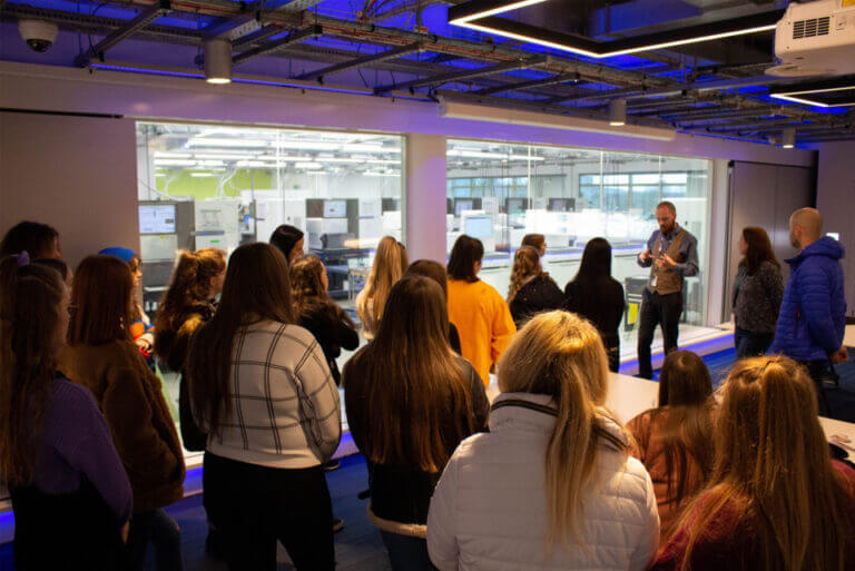 A group of young people visiting an engagement space on the Wellcome Genome Campus.